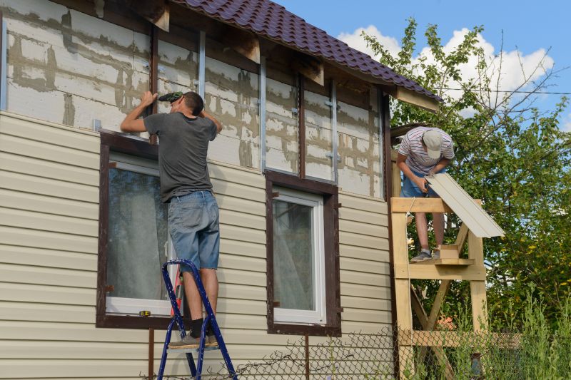 Insulated Vinyl Siding Being Applied